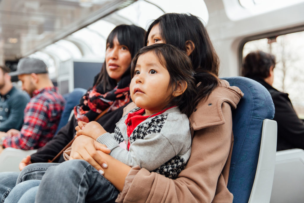 Family with little child on Amtrak train